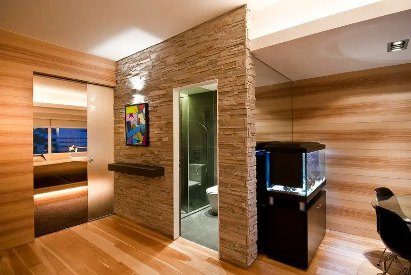 A frosted glass door to the bedroom provides light to the entry vestibule