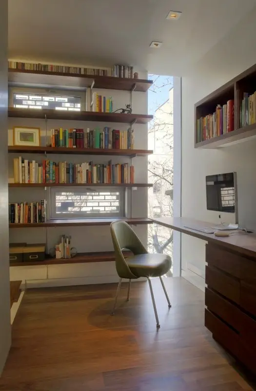 The four-story library adds to the home's privacy while adding functionality.