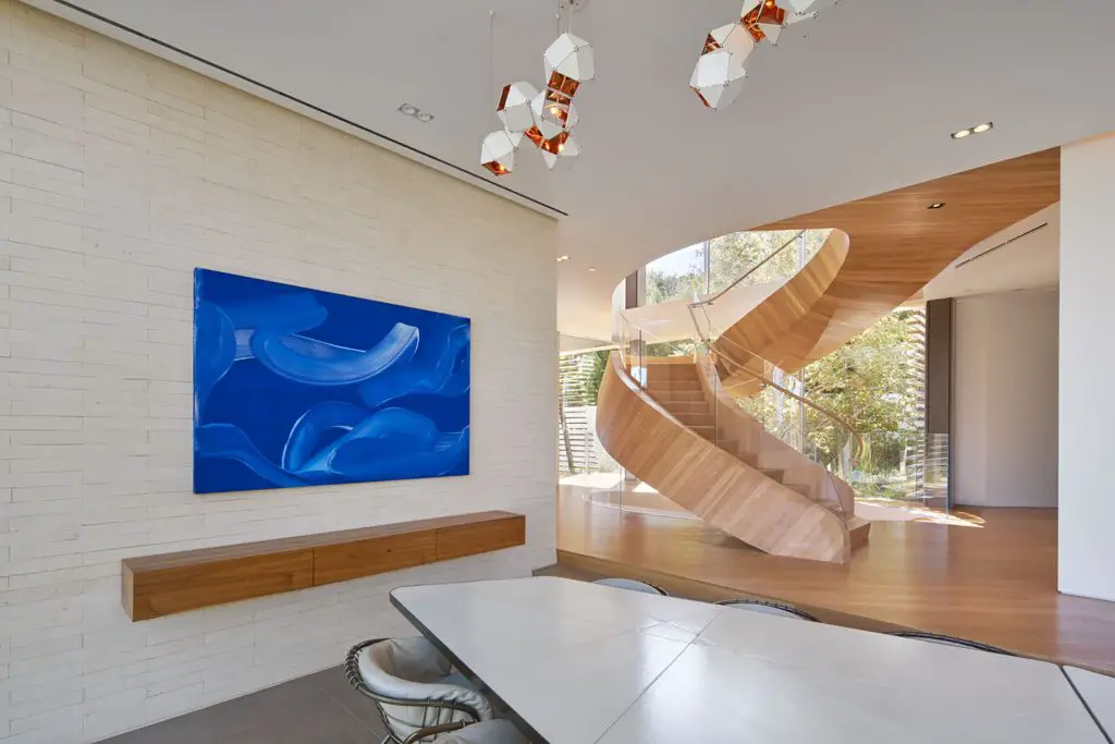 A helical staircase is a focal point of the house.