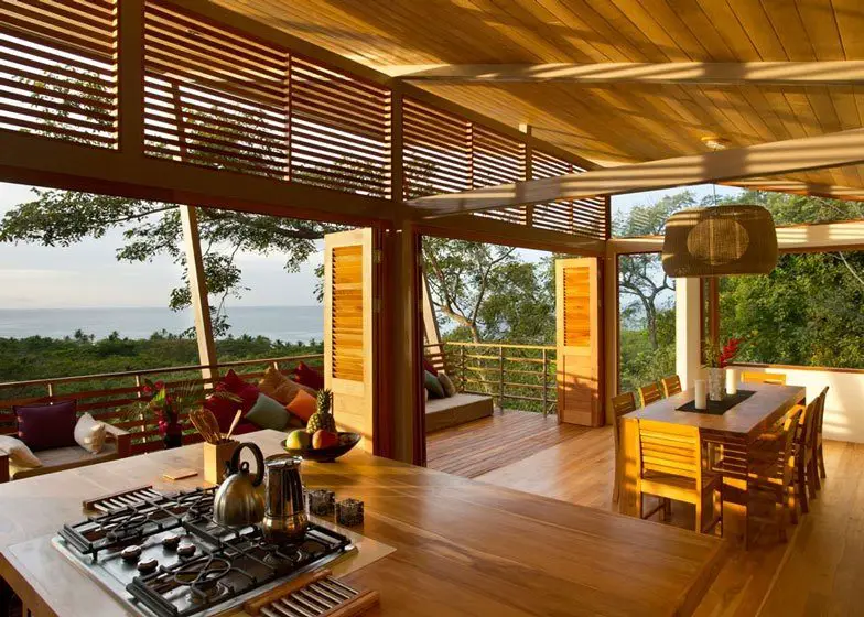 Floating above the steep incline, the home offers magnificent views over the jungle to the ocean