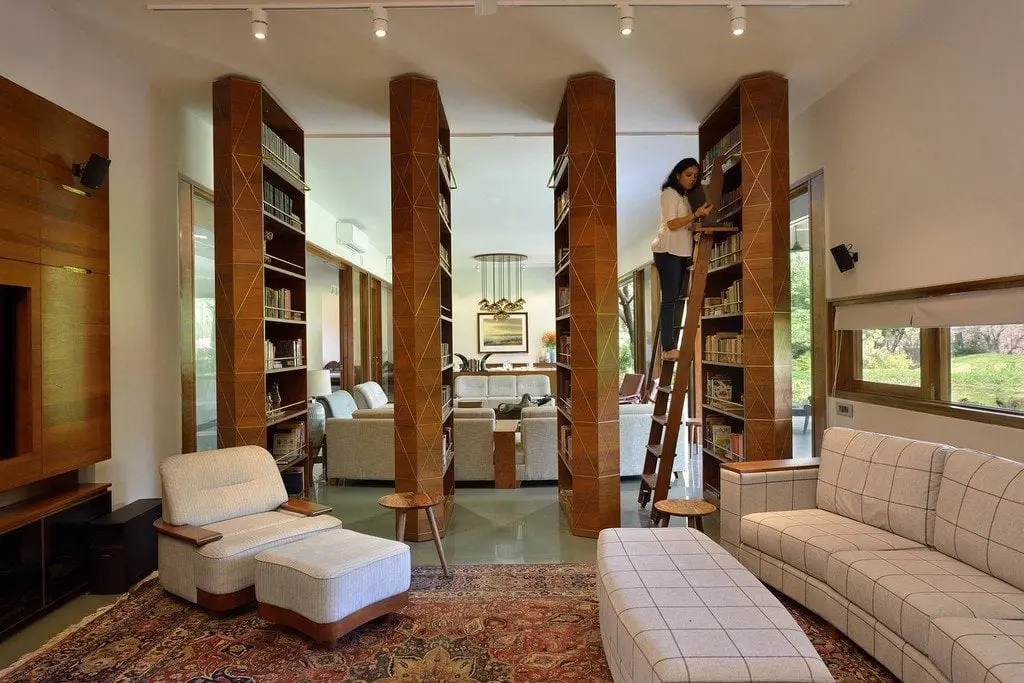 Four rotating bookcases separate the social areas of the house.