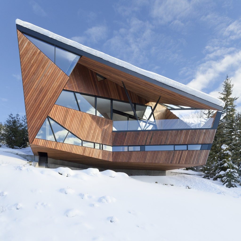 A vision in wood and glass, Hadaway House sticks out from the dazzling white landscape.