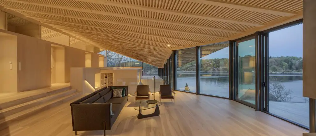 The interiors of the house enrich the beauty of the outdoors through the use of timber walls and flooring.
